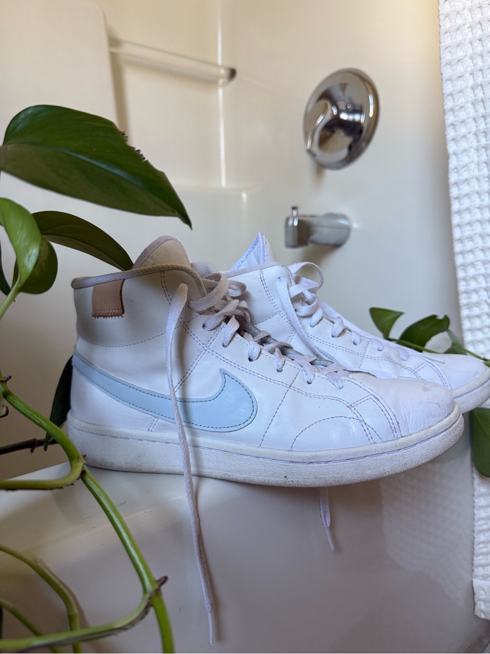 Nike womens White High-Top Sneakers with Light Blue Swoosh Accent